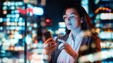 Woman looks at her smartphone